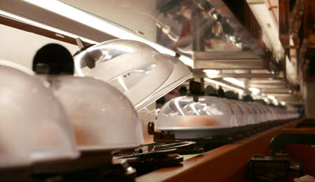 Sushi and sashimi conveyer in Japanese restaurantの写真素材