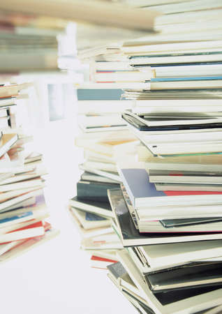 Stack of books on the white table