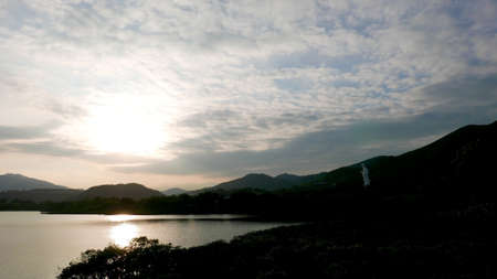 cloudscape and lake landscape photo at sunsetの写真素材