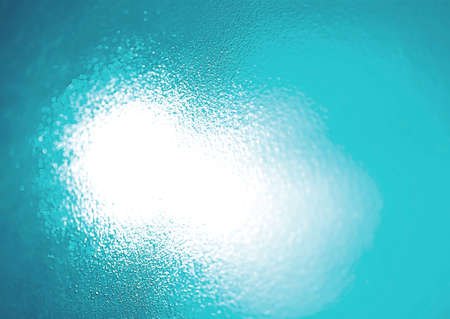 Blue background spot light behind the glassの写真素材