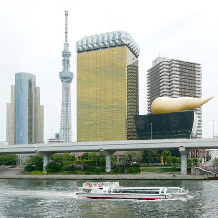 Japan tower, building river and sightseeing boat with skyのeditorial素材