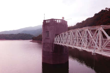 Dam water pond and the human bridgeの写真素材