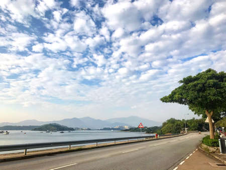 landscape photography - boat, lake, road with dramatric cloud