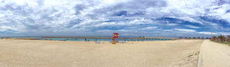 Panorama view Okinawa beach, lifeguard station, white cloud and seaの写真素材