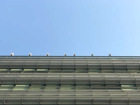 part of commercial building and the blue skyの写真素材