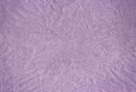 The Purple blank crumpled and grungy textured paper backgroundの写真素材