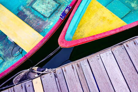 The colorful recreational boats and wooden pier from top view angleの写真素材