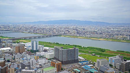 The Japan Osaka city, buildings, river and bridge from aero viewのeditorial素材