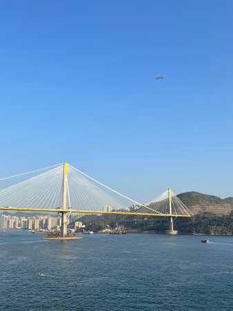 The crowded residential apartment buildings, bridge, ships and aeroplane in Hong Kong