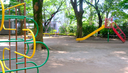 The yellow joyful slide and climbing frame for child and kids in Japan playground
