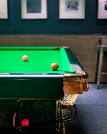 Traditional snooker balls and game table from side view