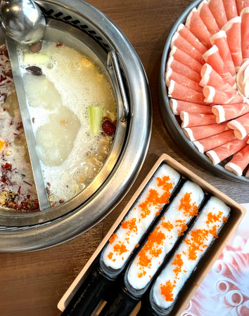 Hotpot soup, raw beef sliced meat meal on table