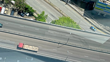 The horizontal Hong Kong urban downtown district and city road structure from top aerial at daytime