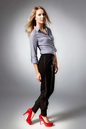 Girl posing in studio for fashion photos in several stylesの写真素材