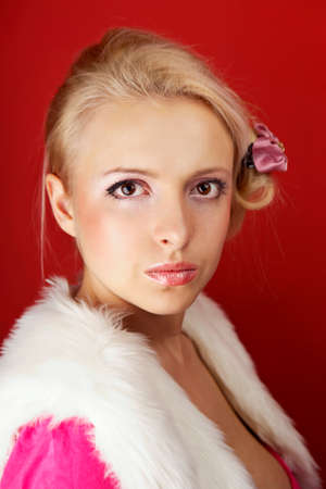 Fashion retro home style portrait of woman posing on interior location like an fancy housewife.の写真素材