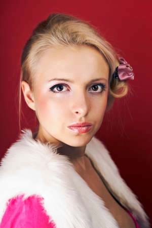 Fashion retro home style portrait of woman posing on interior location like an fancy housewife.の写真素材