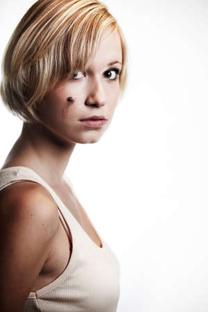Blonde young pretty girl posing in studio for portrait photos in white A shirtの写真素材