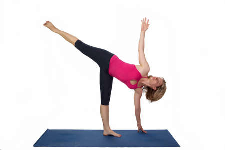 Yoga poses in studio - woman model exercising firs series of yogaの写真素材