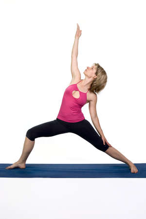 Yoga poses in studio - woman model exercising firs series of yogaの写真素材