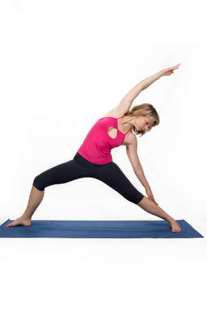 Yoga poses in studio - woman model exercising firs series of yogaの写真素材