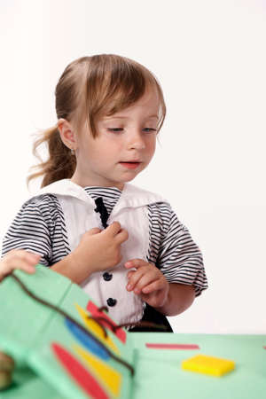 Children at play with color foam toys in studio enjoying their moments of games.の写真素材
