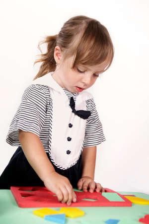 Children at play with color foam toys in studio enjoying their moments of games.の写真素材