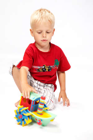 Children at play with color foam toys in studio enjoying their moments of games.の写真素材