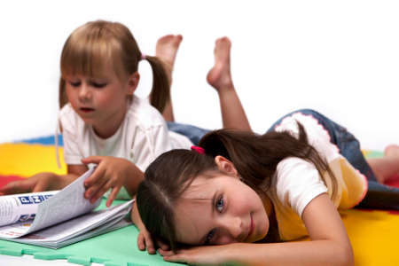 Children at play with set of rubber foam toys in studio on white backgroundの写真素材