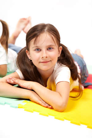 Children at play with color foam toys in studio enjoying their moments of games.の写真素材