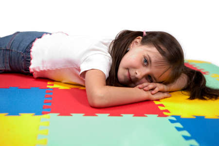 Children at play with set of rubber foam toys in studio on white backgroundの写真素材