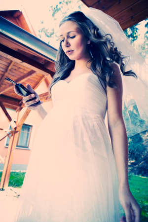 Nice young woman on wedding day - bride in bridal gownの写真素材