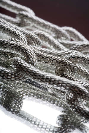 Costume jewellery on the mirror in silver color, photo of detail
