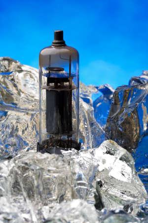 Radio tube frozed on ice block in studioの写真素材