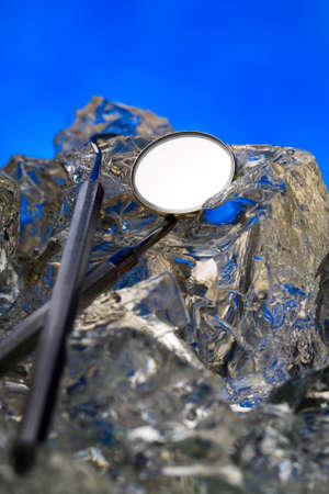 Medical instruments on ice - frozen steel and health careの写真素材