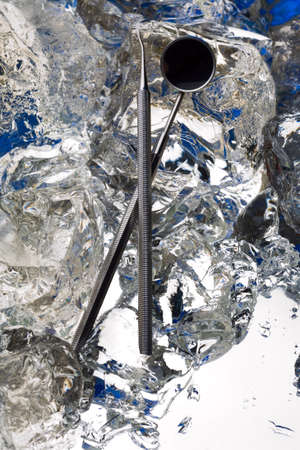 Medical instruments on ice - frozen steel and health careの写真素材