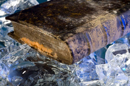 Old book damaged by water during floods on frozen iceの写真素材
