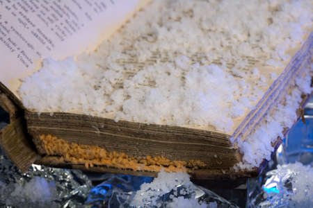Scarce book damaged by water during floods on frozen iceの写真素材
