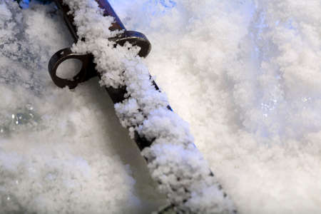 Old bayonet in iceの写真素材