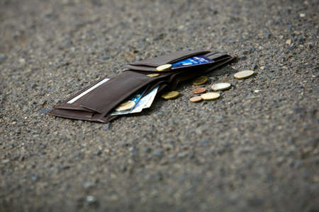 Lost man wallet at the park sidewalk