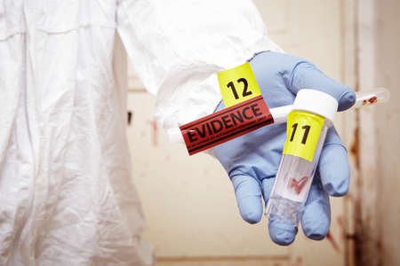 Evidences of blood stains in police handsの写真素材