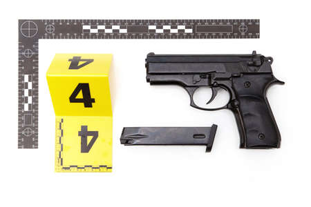 Police evidence of handgun with illegal silencer and ammunitionの写真素材