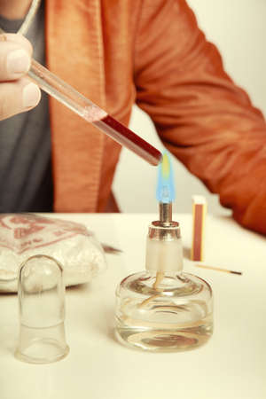 Drug dealer testing quality of delivery with chemicals