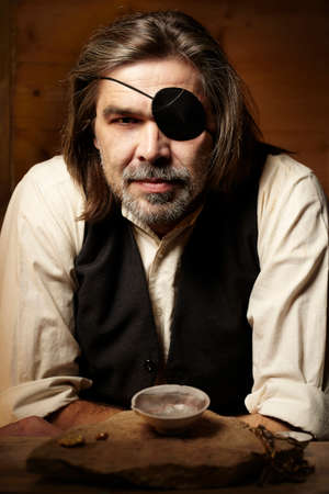 Burglar after illegaly melting of stolen gold pieces at homeの写真素材