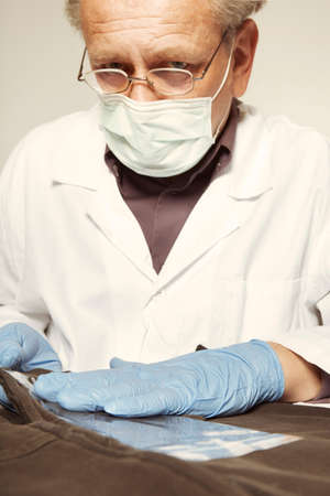 Checking and pickup of unvisible microtrace evidence from dressの写真素材