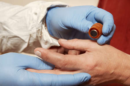 Proccess of collecting possible gunshot residue from suspected man indoorの写真素材