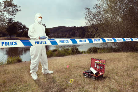 Crime scene investigation - working with evidence on place of crimeの写真素材