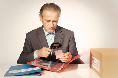 Police officer studying collection of evidences