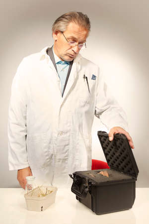 Museum specialist unboxing prehistorical artifact statueの写真素材