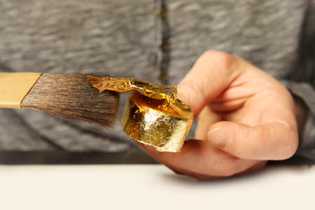 Artwork of gilding - covering an object with plate metal goldの写真素材