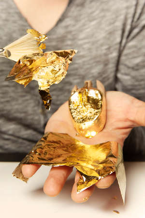Artwork of gilding - covering an object with plate metal gold